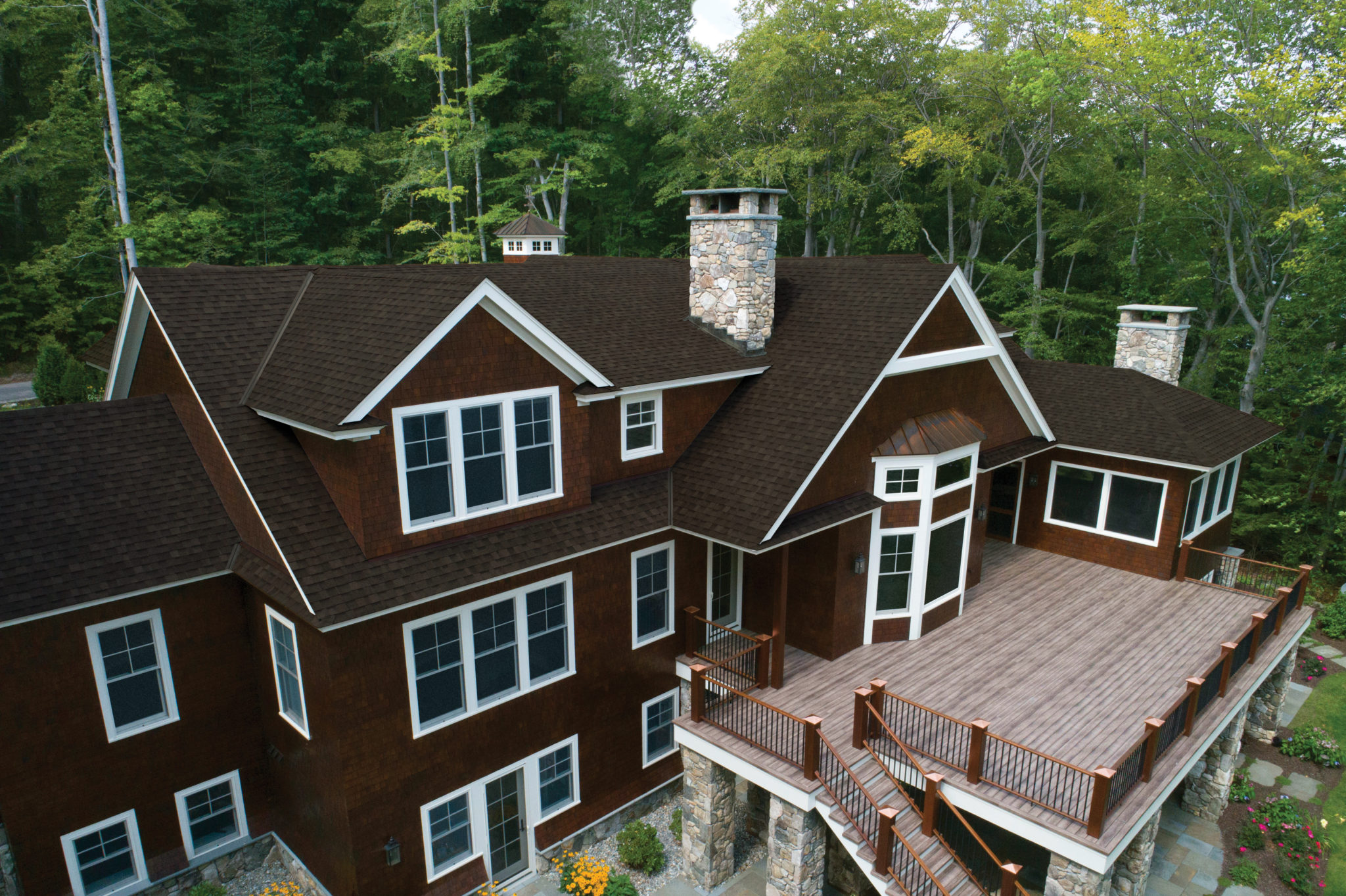 three story house with an IKO Cambridge Driftwood roof