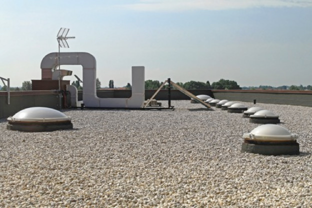 a ballasted commercial roof with skylights