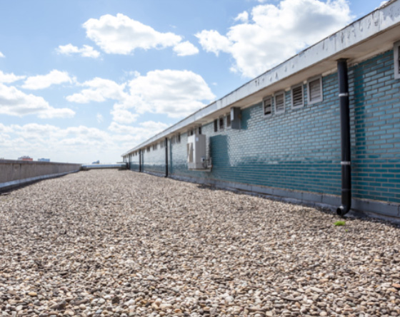 large commercial roof with gravel placed over roof membranes