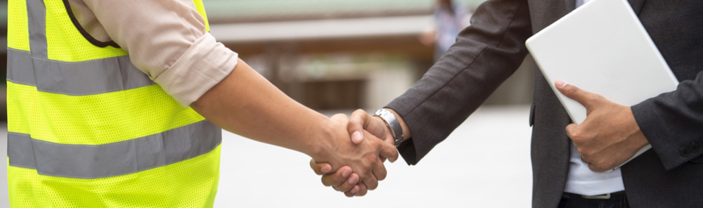 commercial roofing contractor shaking property manager's hand