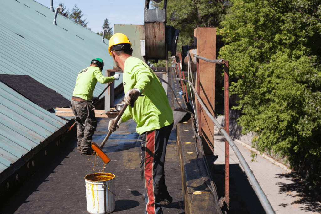 commercial roofers working on a flat roof