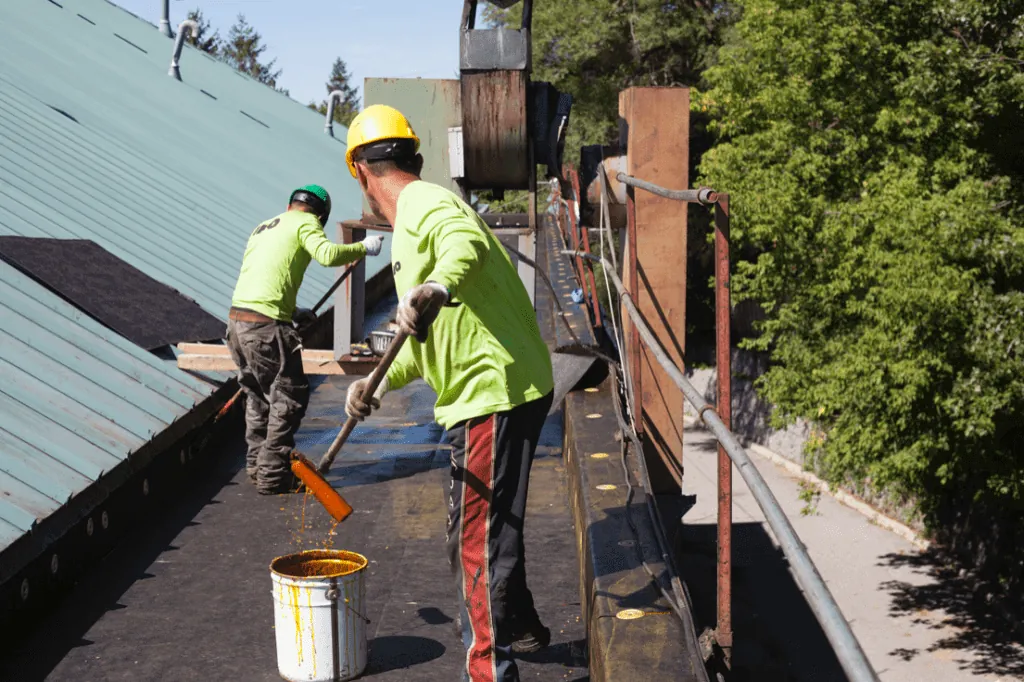 commercial roofers working on a flat roof commercial roofers working on a flat roof