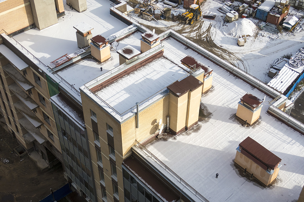 snow on flat rooftop