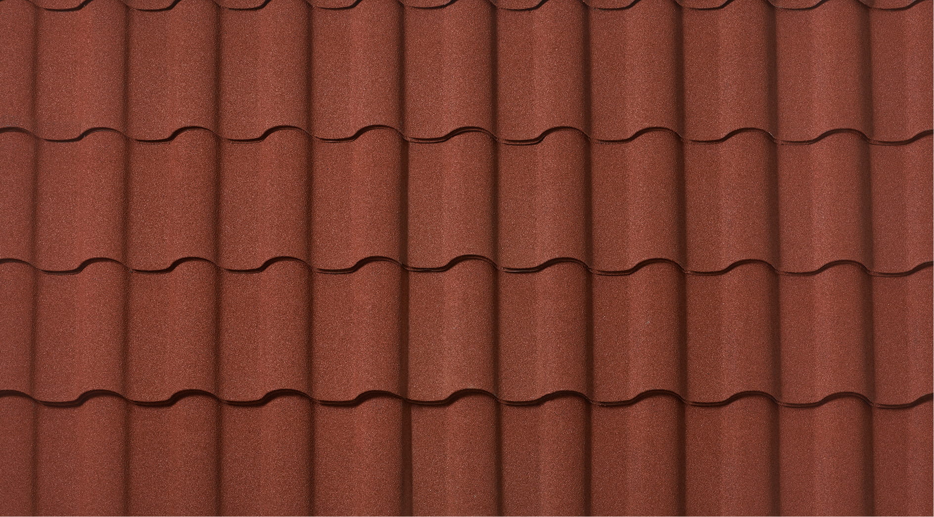 DECRA Spanish-style barrel tile sample in Canyon Terra red-brown with natural stone granule texture for premium metal roofing