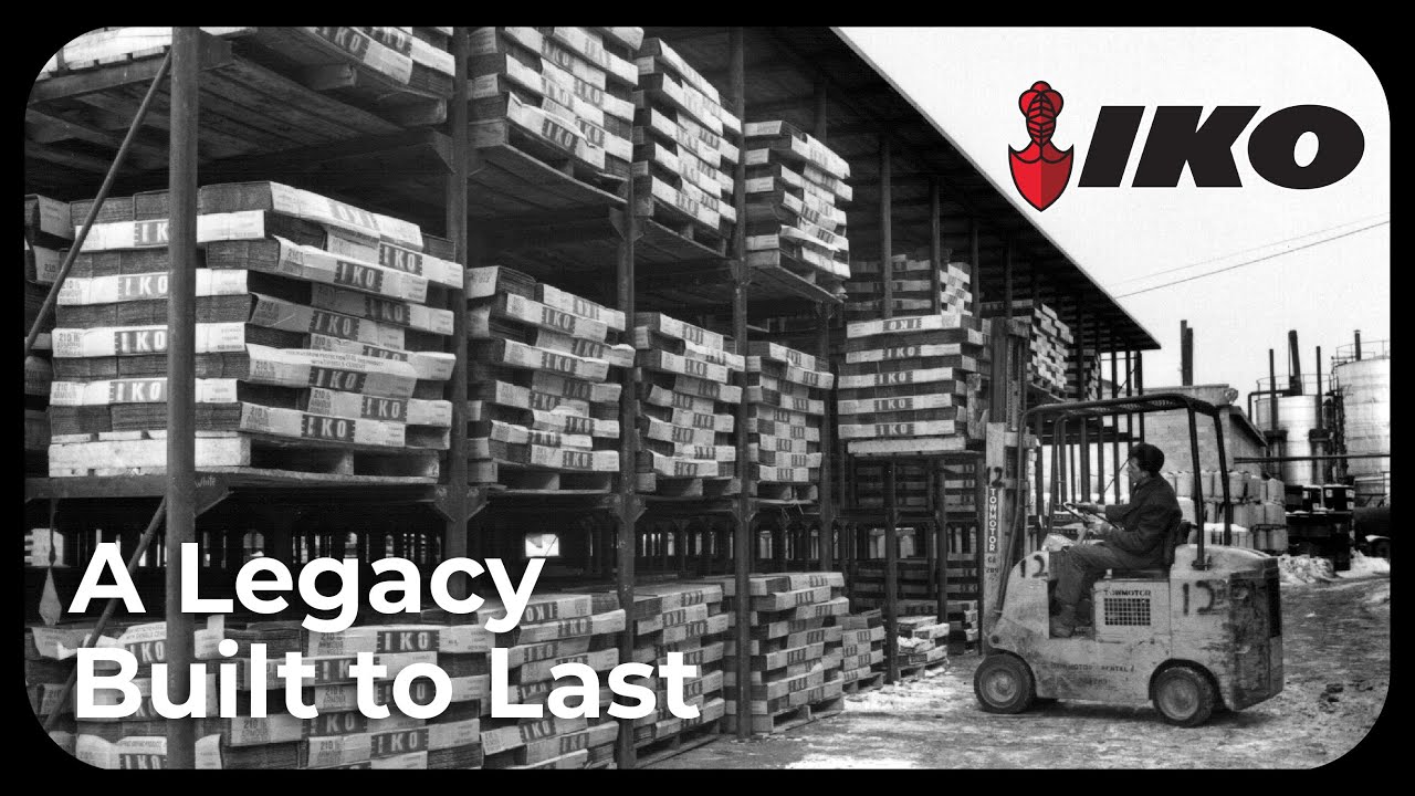 A Legacy Built to Last: vintage black-and-white photo of a forklift operator in front of tall stacks of IKO-branded shingle bundles in a warehouse