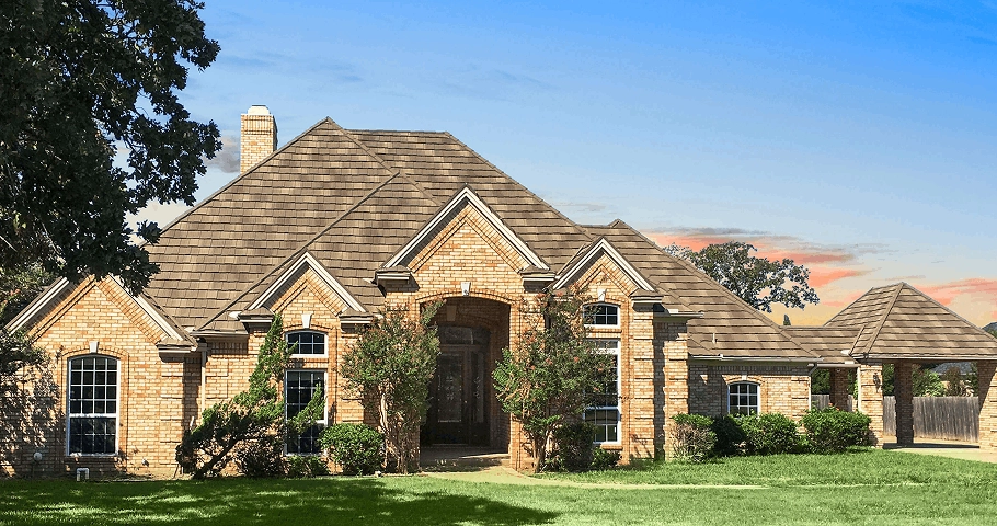 Farmhouse Shake Heritage Stone metal roof on brick home, stone-coated panels with shake texture and strong curb appeal