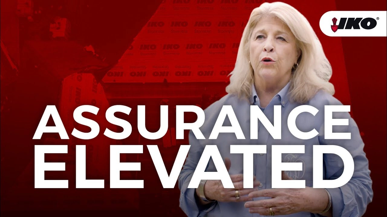 A woman speaks in the foreground with a red background and the text "Assurance Elevated." The IKO logo is in the top right corner, reflecting IKO Integrity Roofing.