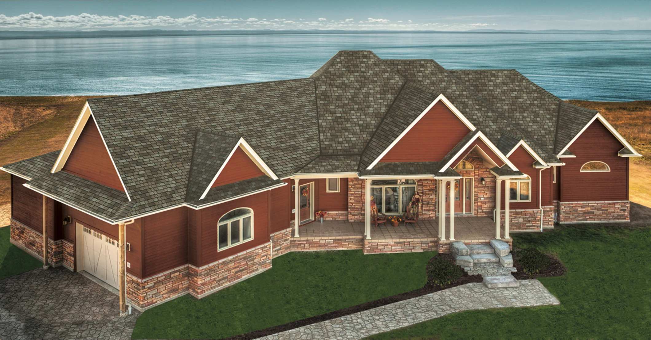 Red brick house and light-colored siding exterior, featuring a grey shingle roof and white trim accents.