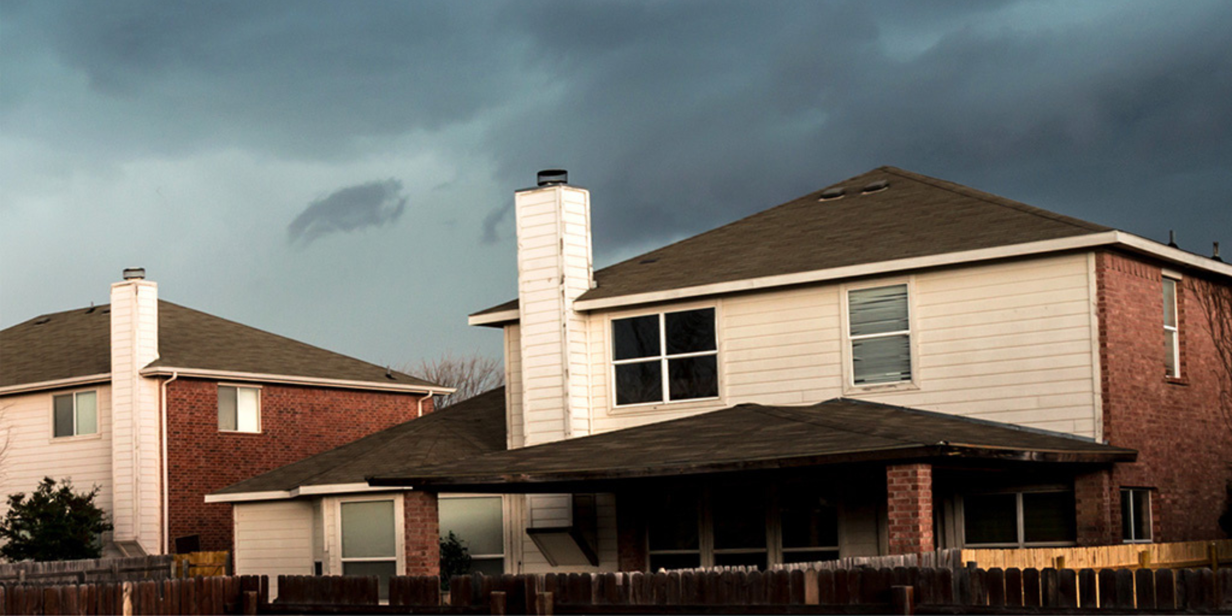 Home with stormy background