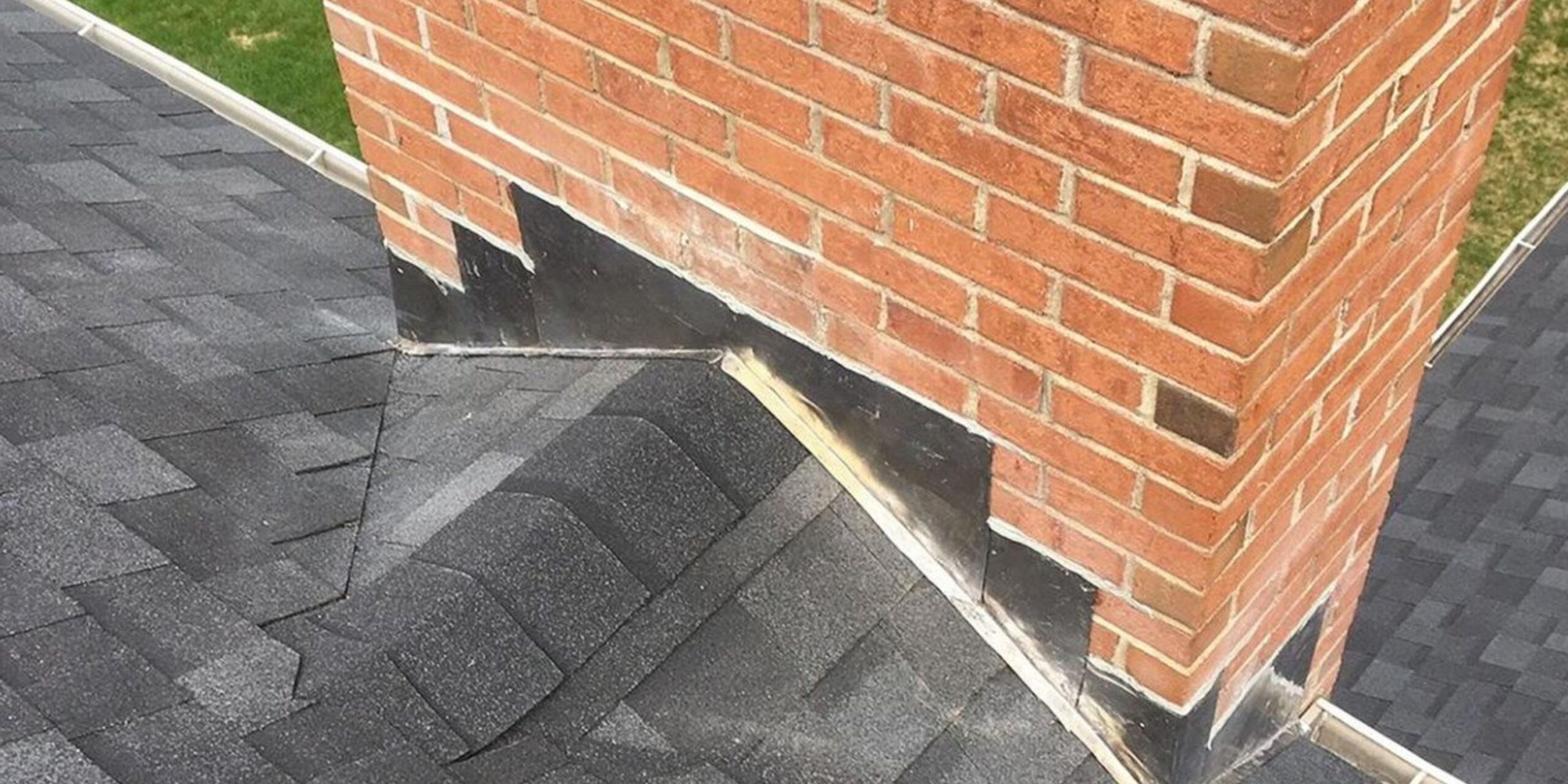 shingled cricket behind a chimney