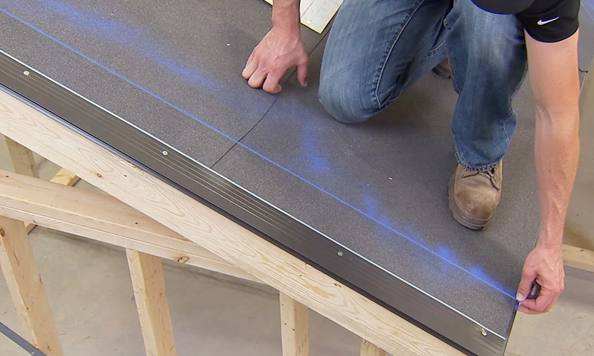 roofer snapping a chalk line