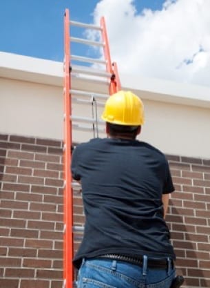 roofer climbing extension ladder 