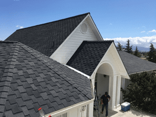 IKO Armourshake premium designer shingles in Shadow Black color shown on roof of Hollister, California residence.