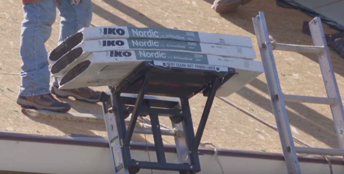 IKO Nordic Class 4 shingles being lifted to home's rooftop