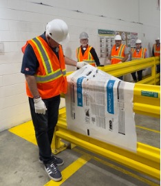 John Brassard (Member of Parliament for Barrie South&ndash;Innisfil), Guy Tremblay (Vice President of Operations, IKO North America) and other guests at the plant tour