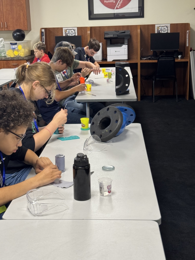 demonstration by Blair&rsquo;s maintenance team used Play-Doh and a clear PVC pipe to show how rubber linings protect industrial equipment &mdash; including railcars &mdash; from corrosion and wear.