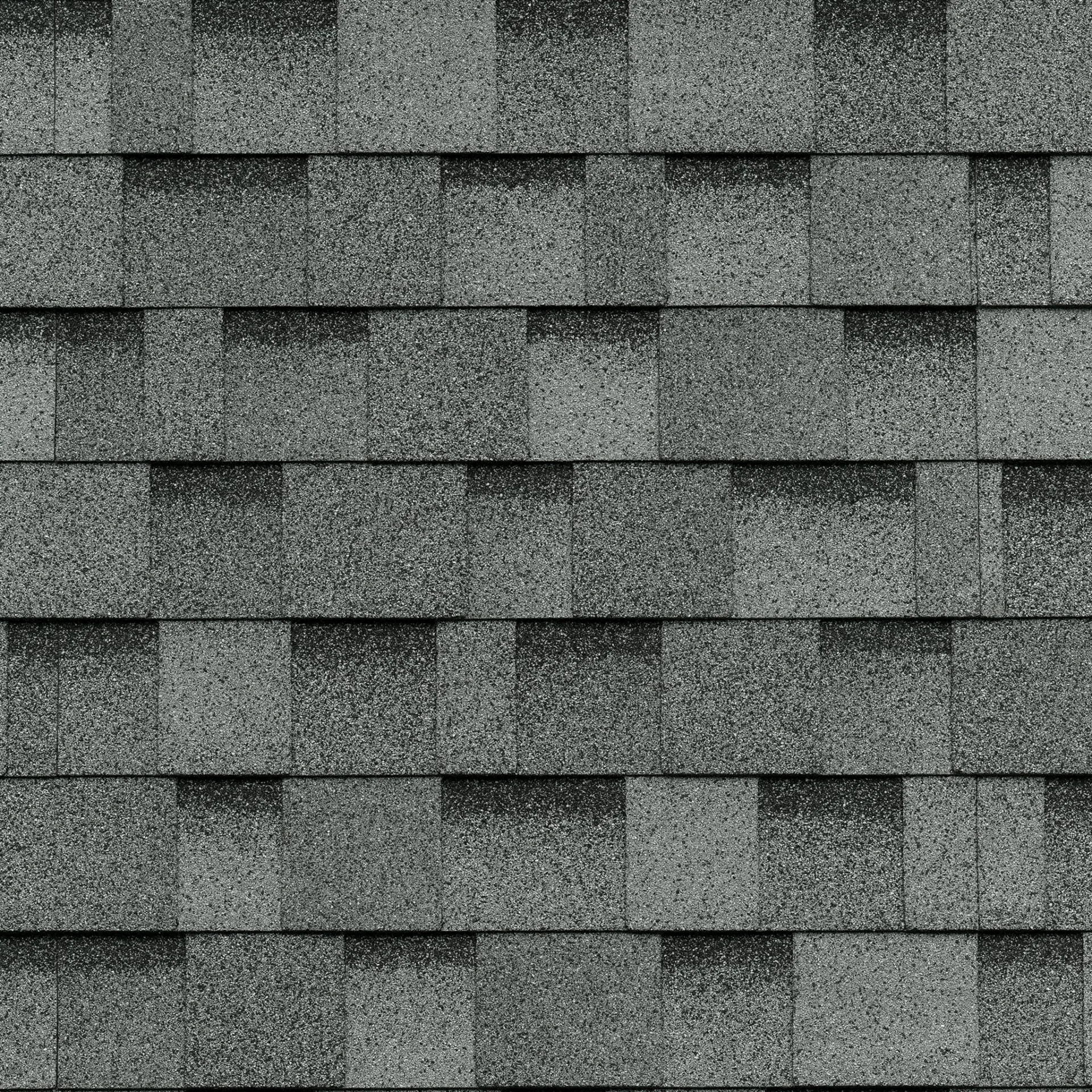 Gros plan de bardeaux de toiture d'asphalte Dual Grey à motif rectangulaire, rappelant le style classique Cambridge.