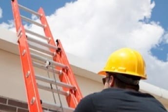 roofer climbing extension ladder