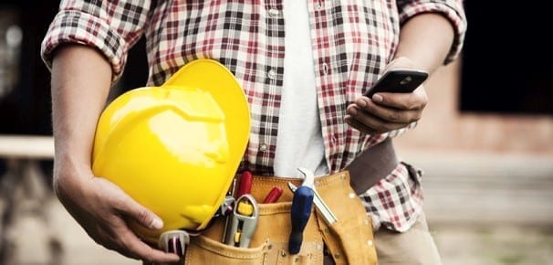 roofer looking at his cell phone