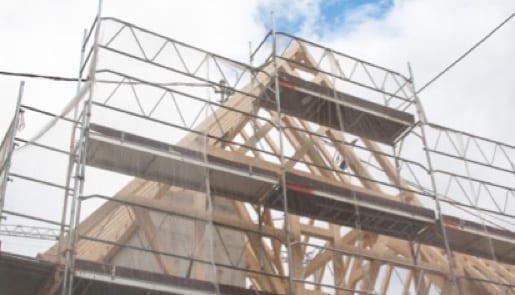 scaffolding in front of a house's roof