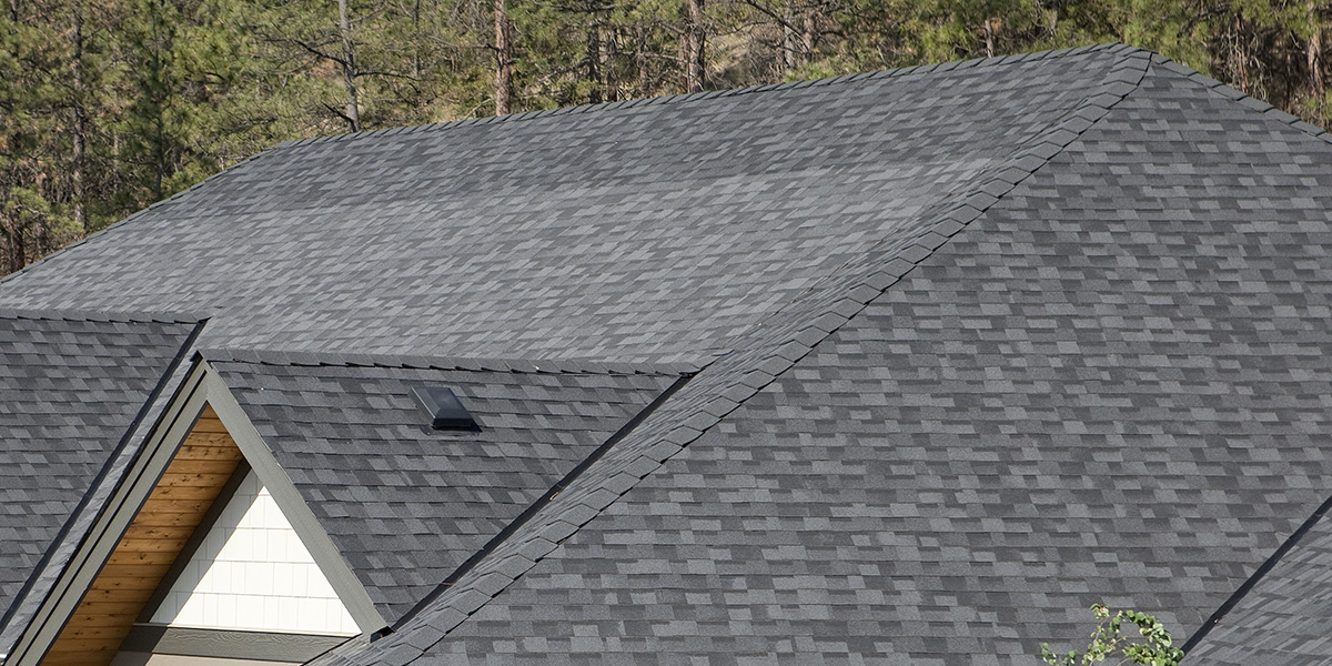 a roof where someone has installed mismatched shingles