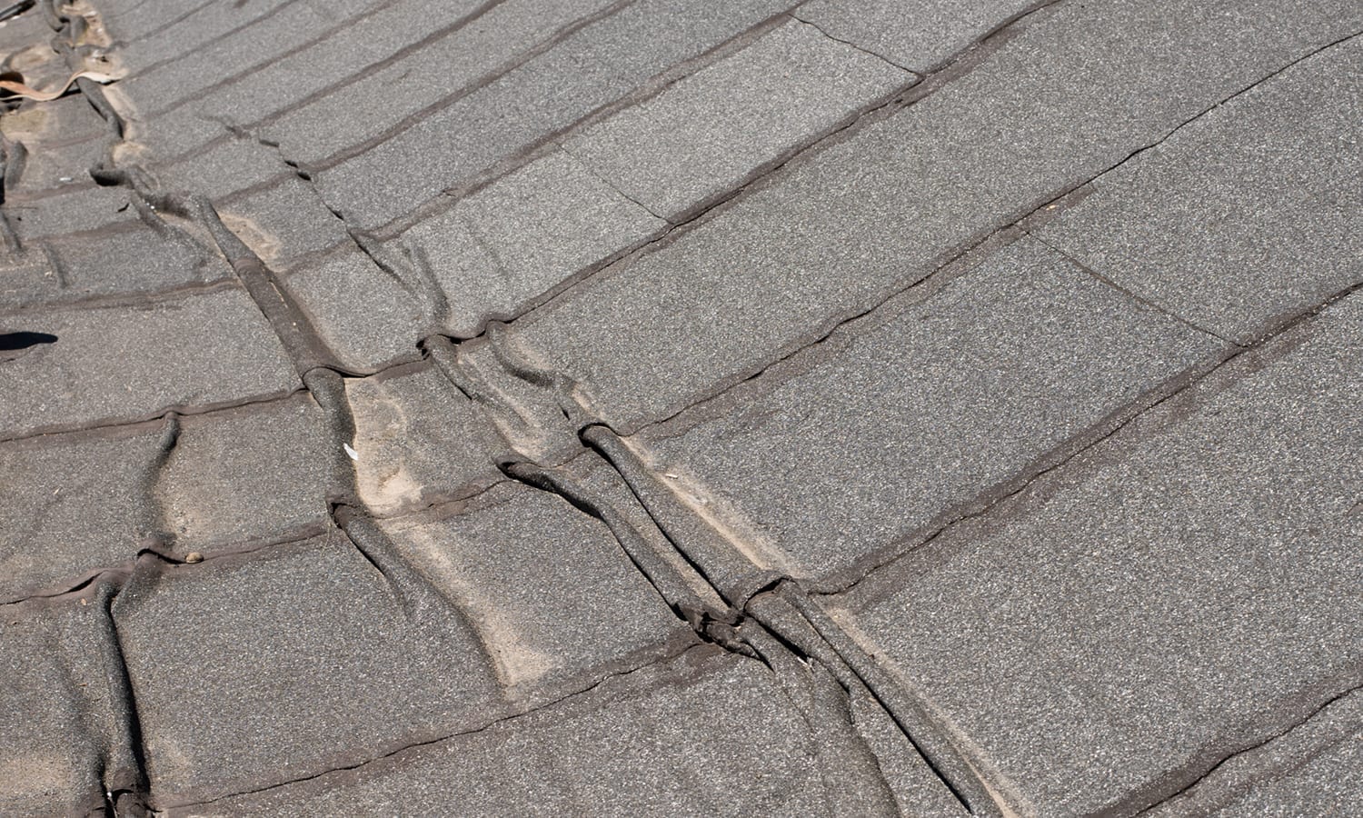 wrinkled and buckled roof membrane