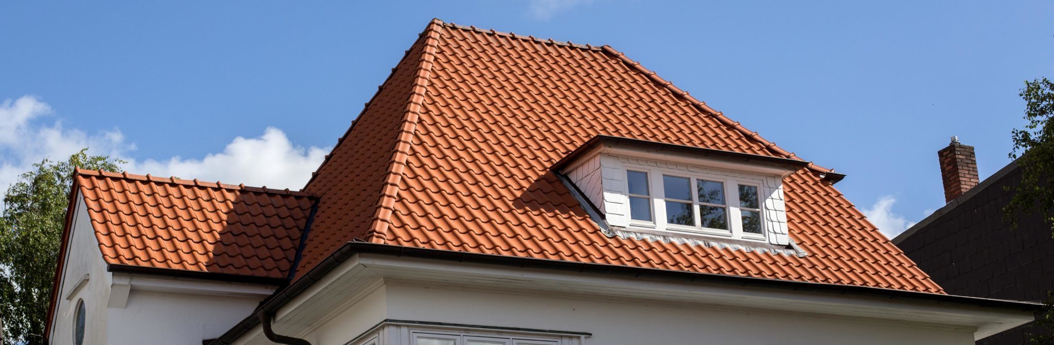 roof with curved terra cotta clay roof tiles