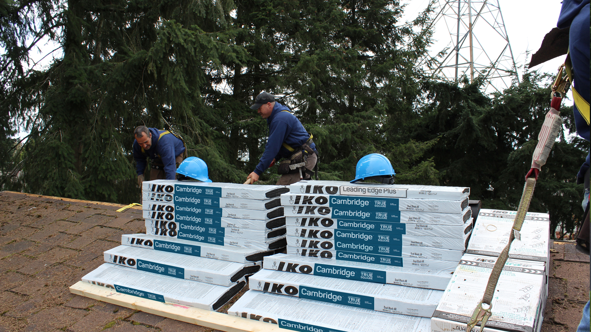 breaking shingle bundles into single bundles-on roof ridge