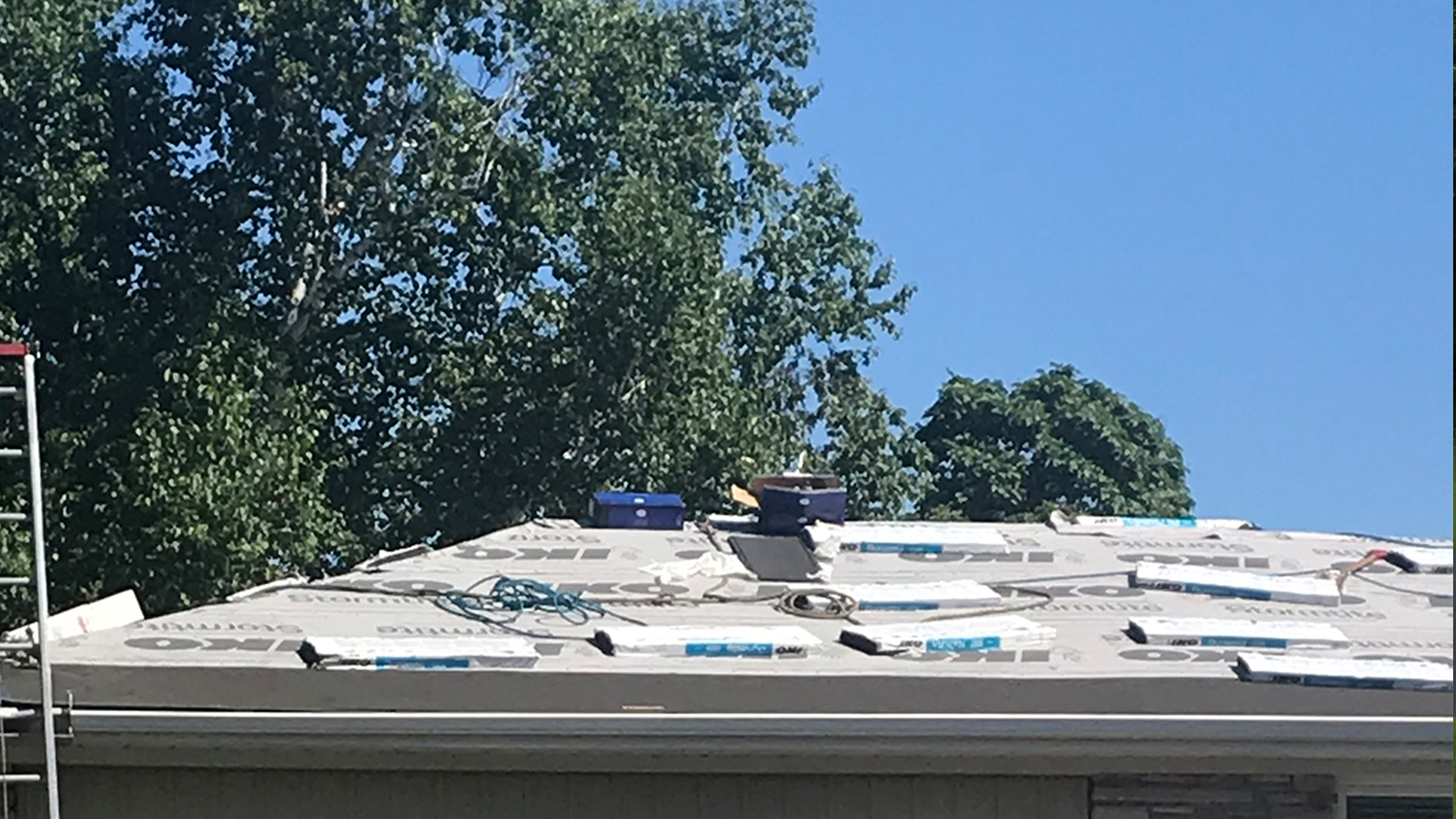 shingle bundles stacked on ridge