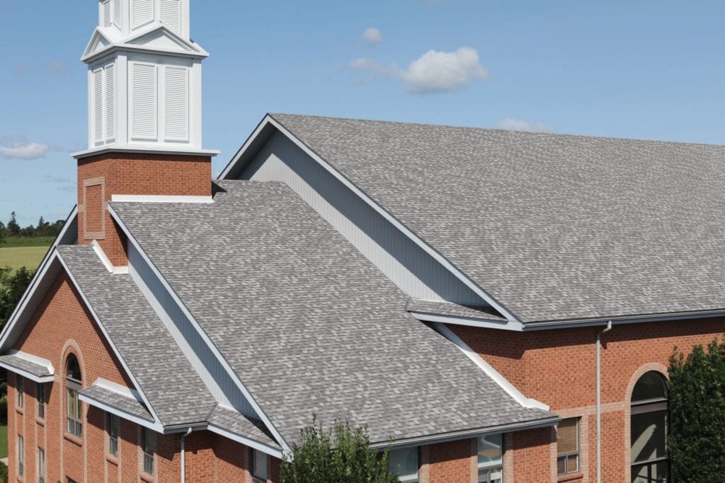 large roof with grey architecrual shingles