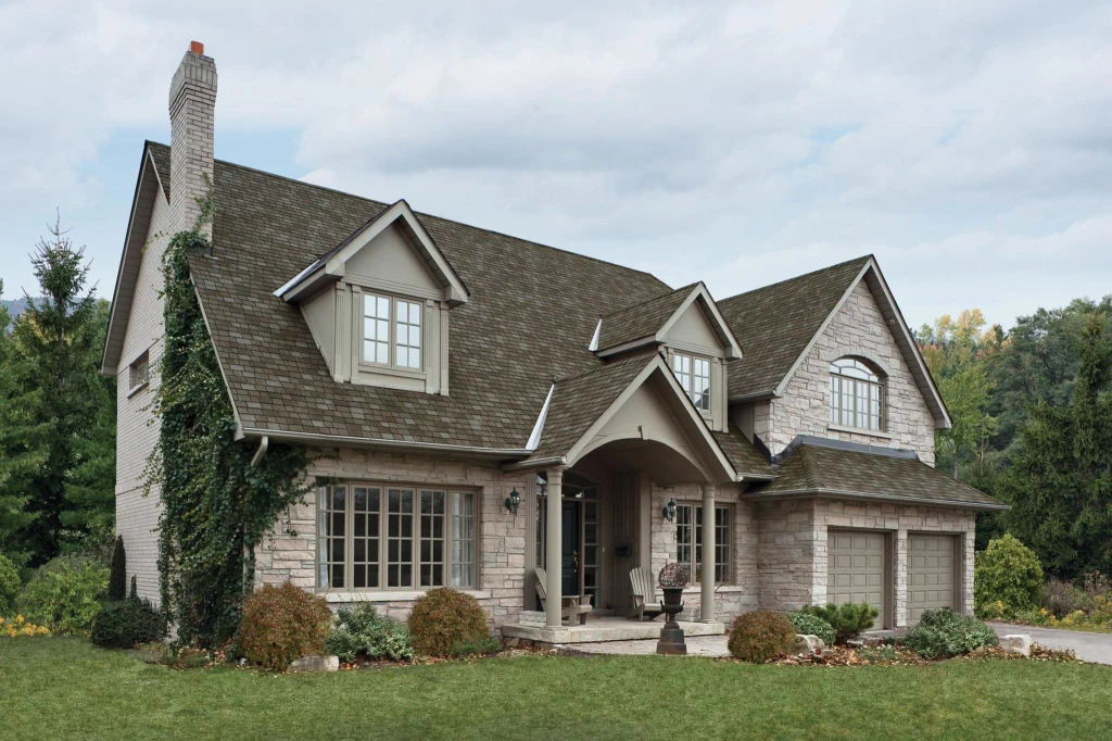 home and garage covered with brown laminated shingles