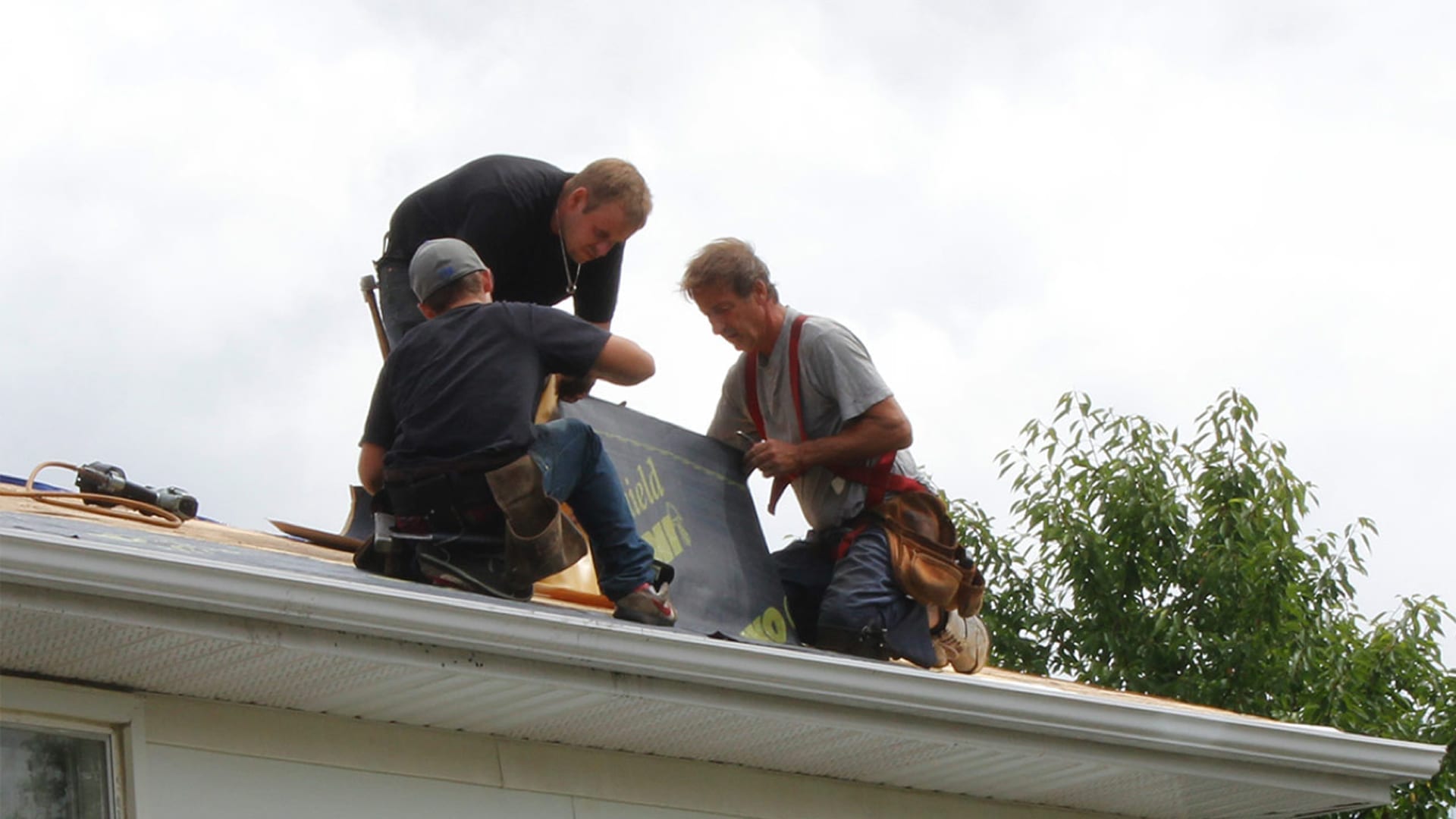 roofers installing IKO GoldShield ice and water protector