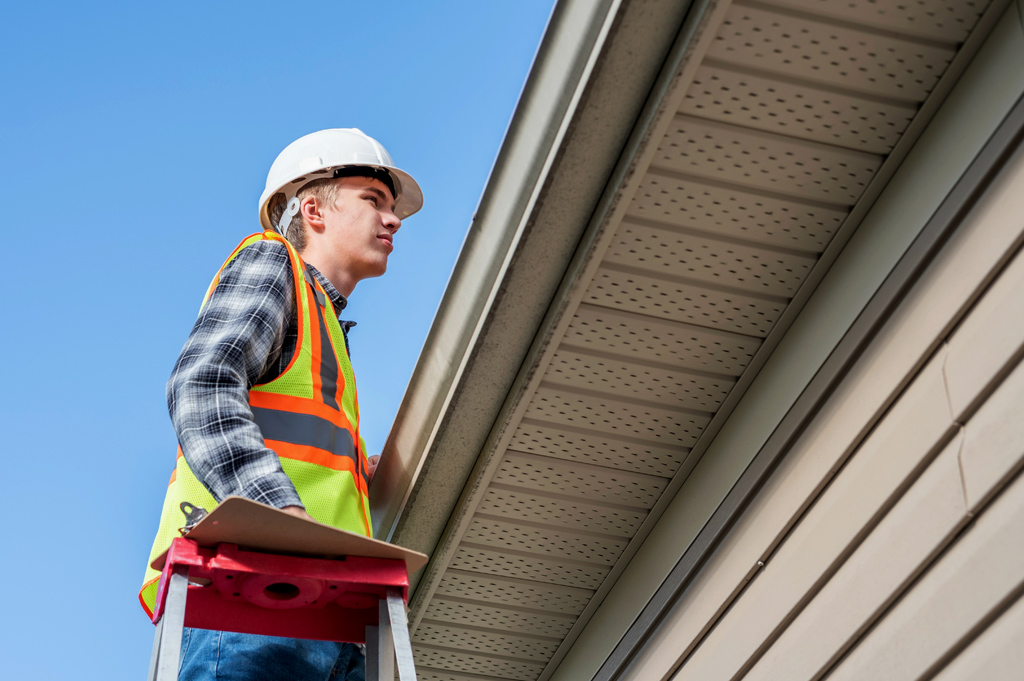 Inspector inspecting roof