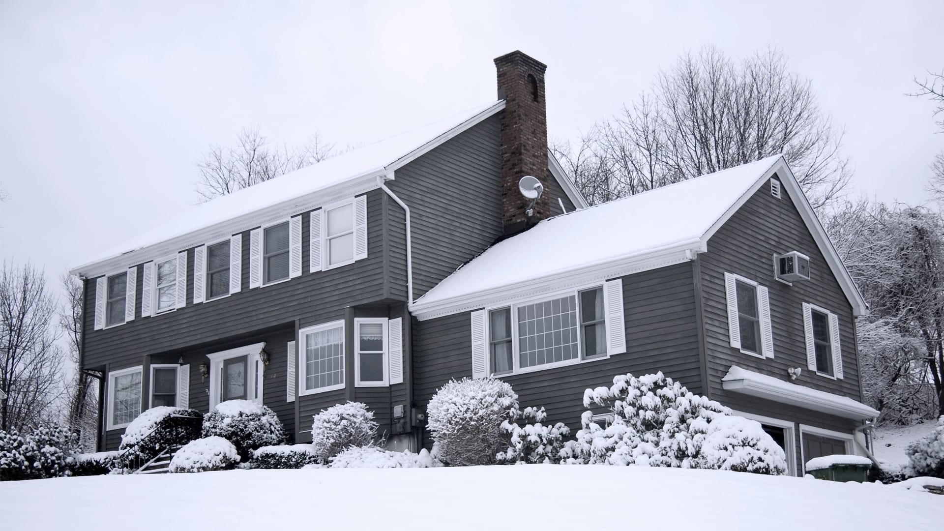 snow on home's rooftop