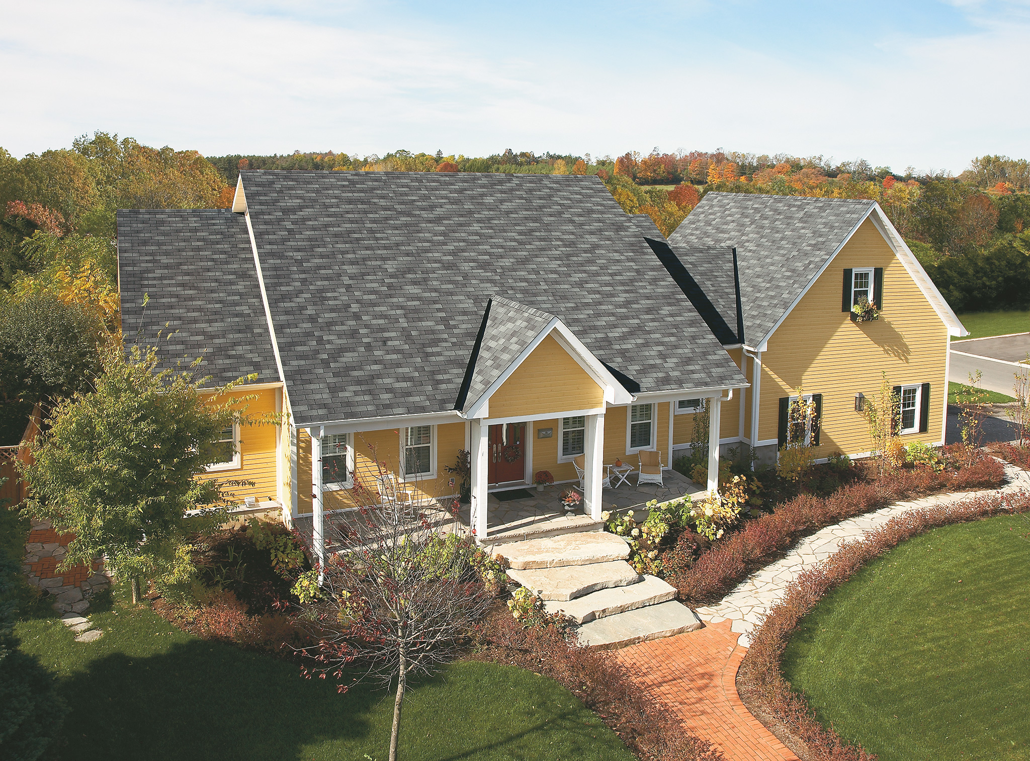 bright yellow siding with charcoal-grey roof shingles