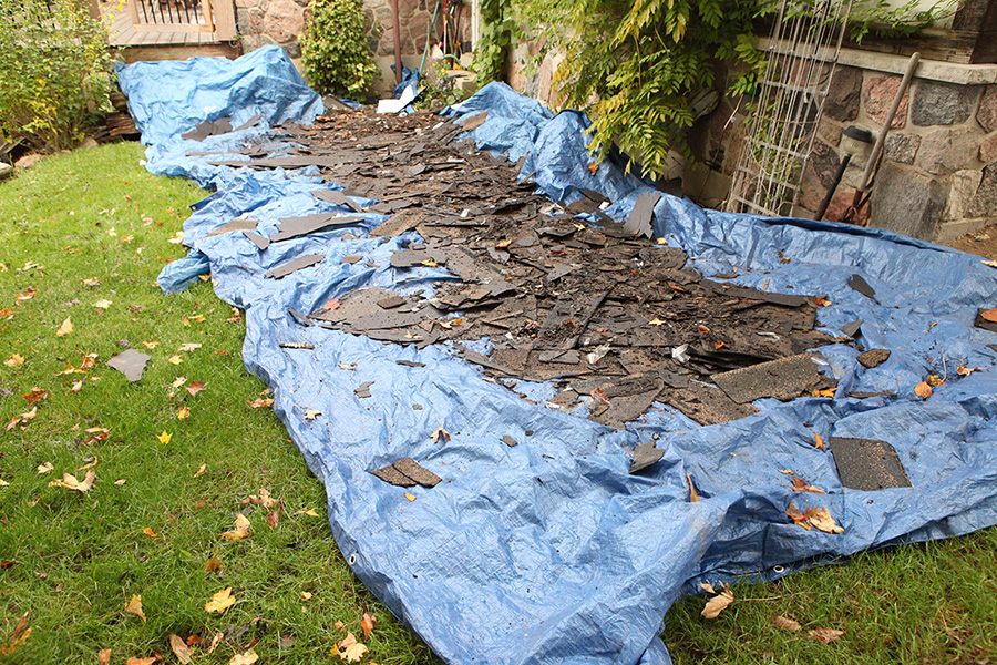 tarp to cartch falling roof shingles when tearing off an old roof