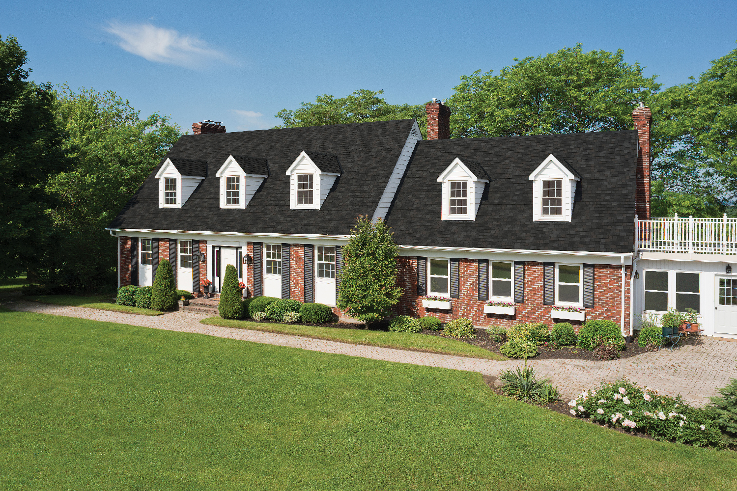 dark grey roof shingles to match red toned brickwork of home