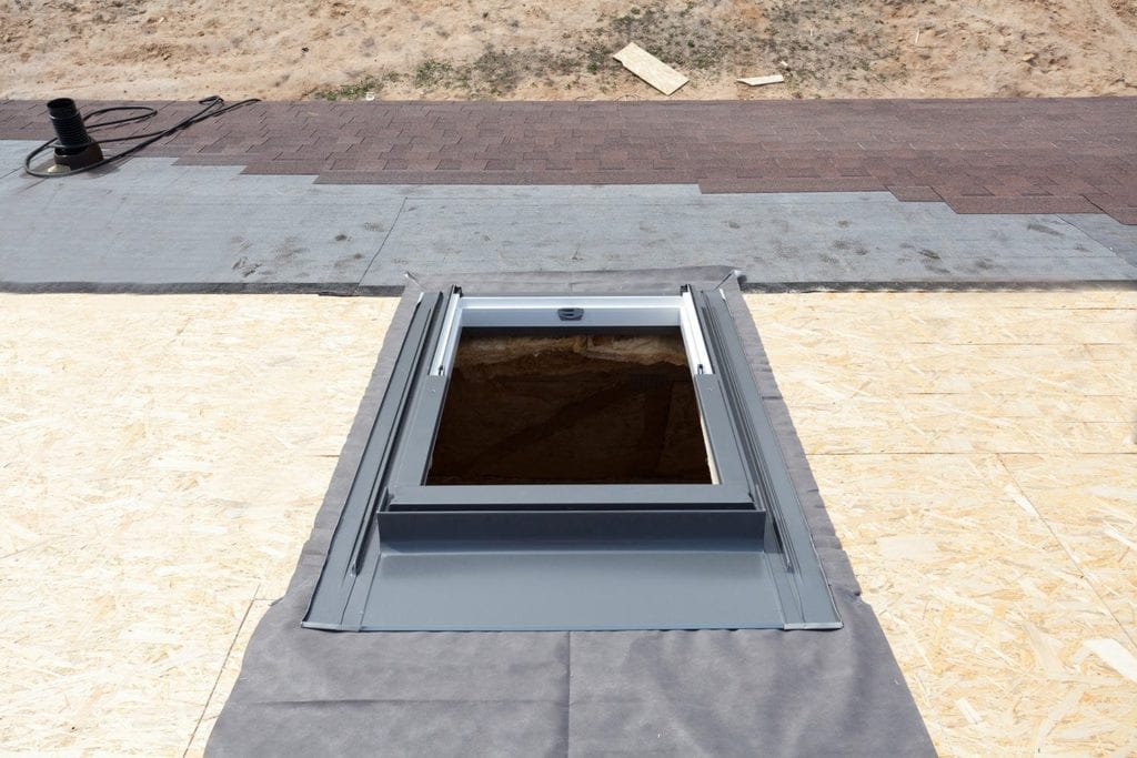 skylight on a roof prior to shingle installation