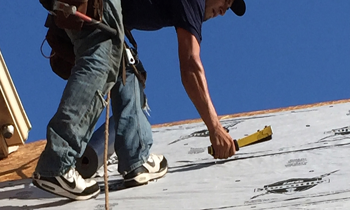 roofer using a Hammer Tacker Stapler