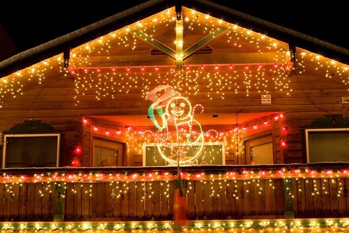 house exterior lit up with Xmas lights
