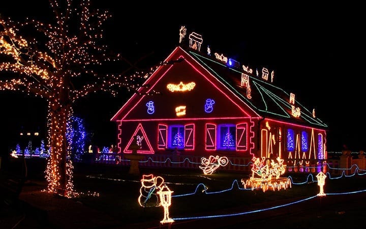 a house's shape oulined by XMas lights