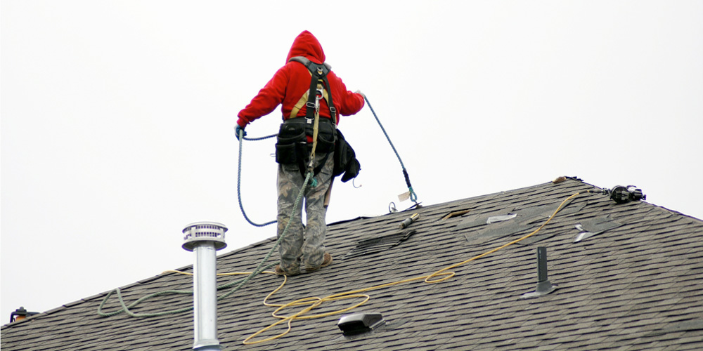 woman working on roof