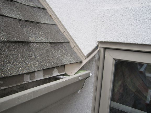 close view of kickout flashing at roof eave