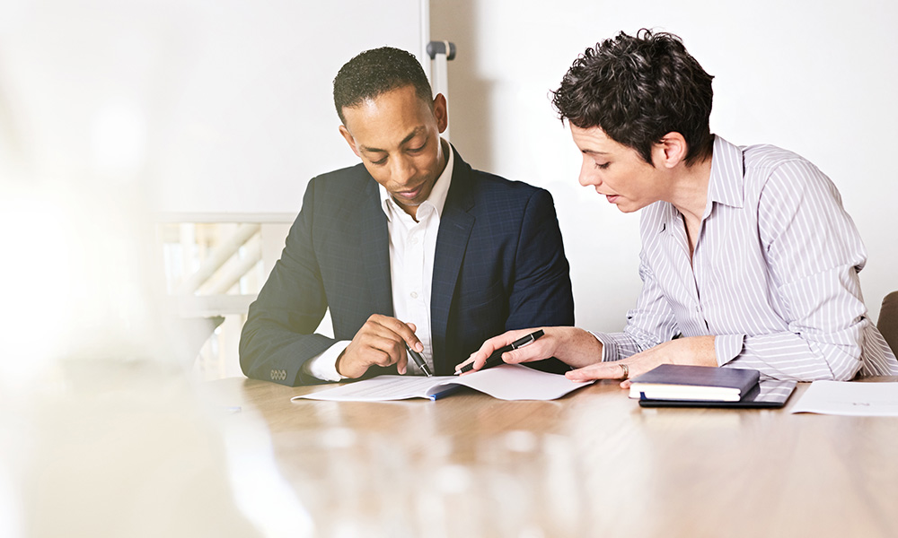 lady and gentleman reviewing legal documents