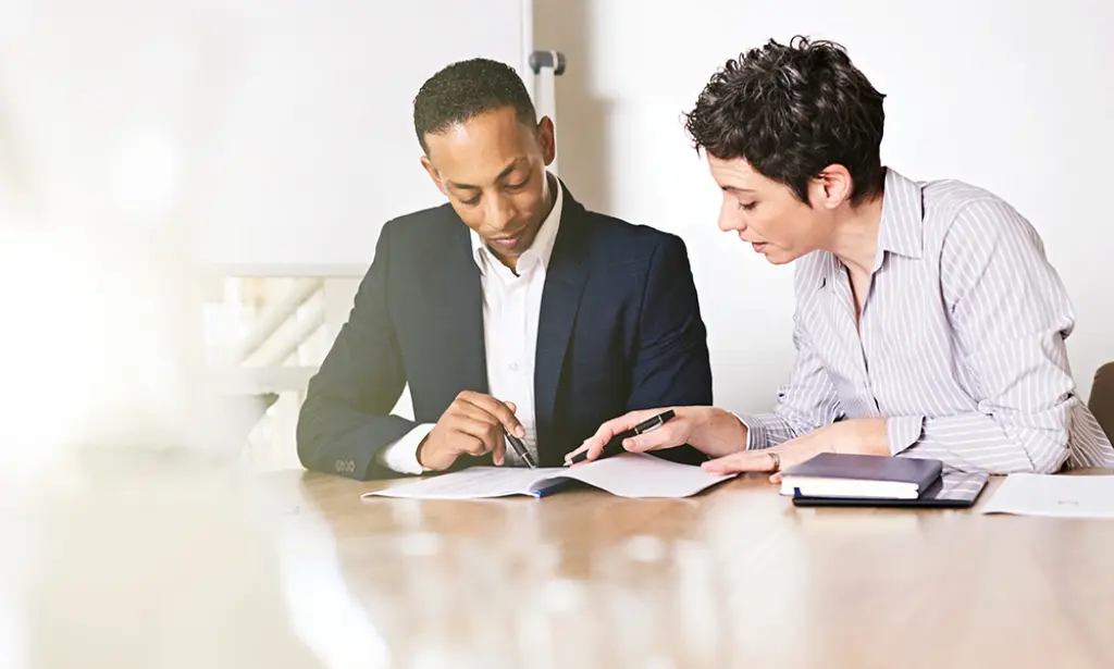 lady and gentleman reviewing legal documents