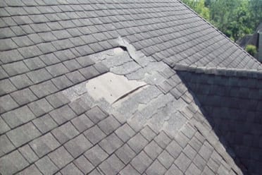 shingles that blown off a roof and are in need of replacing
