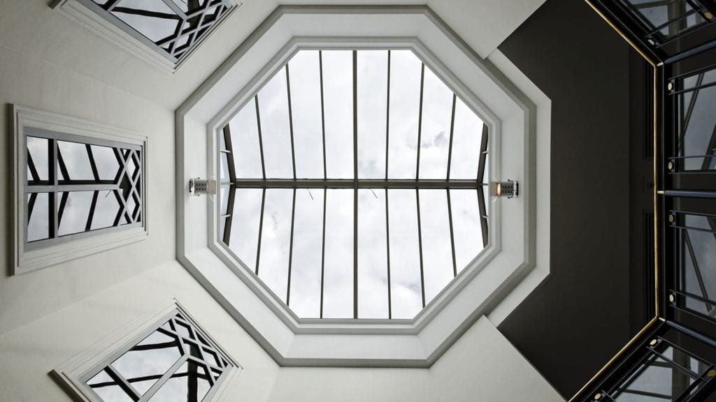 interior view looking up at an octagonal skylight