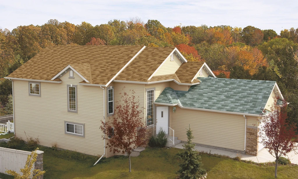 Garage Roof shingles next to home with nonmatching shingle colors