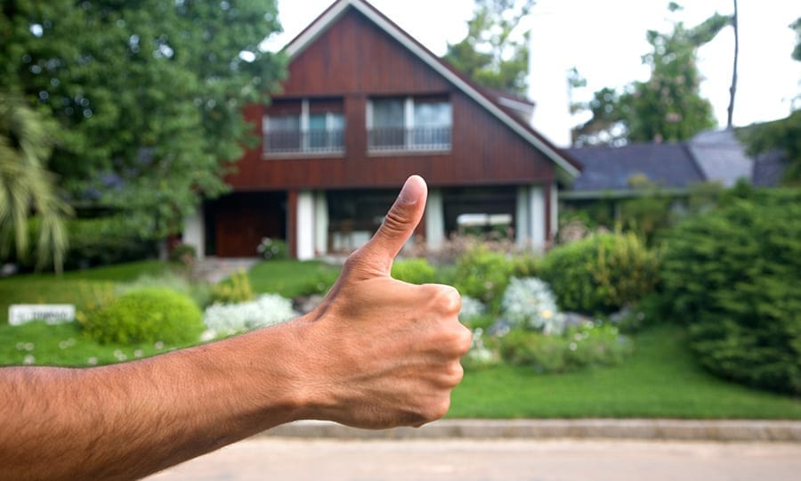 satisfied homeowner happy with his new shingle roof