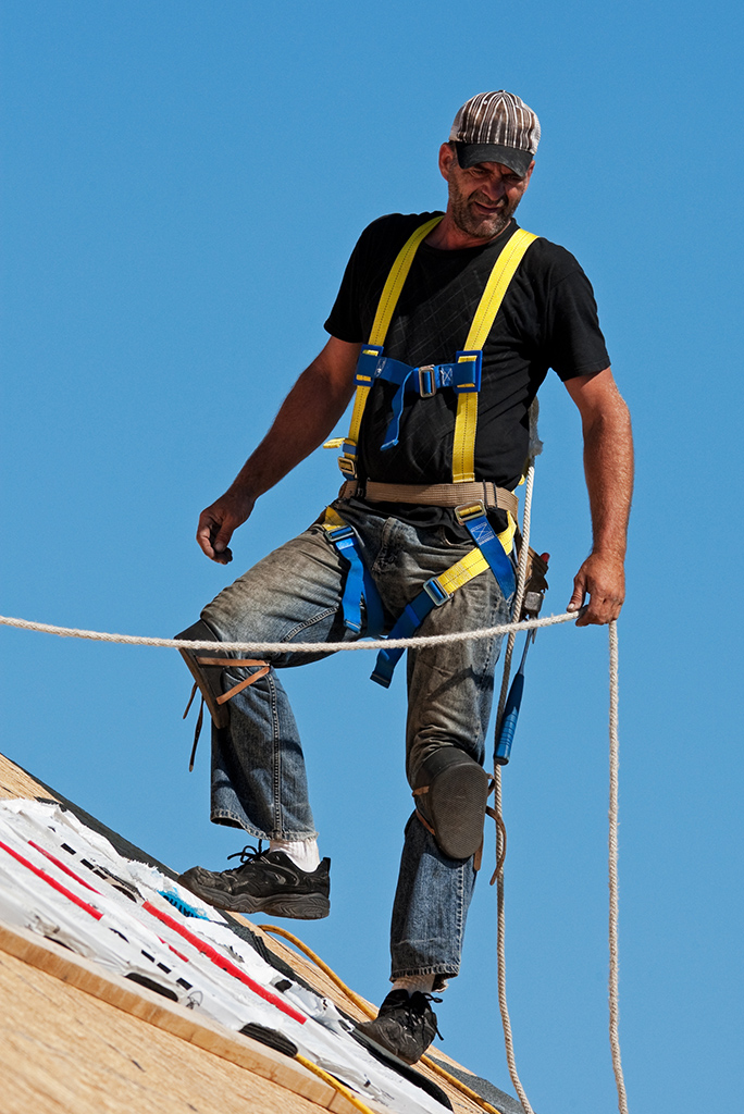 roofer wearing harness